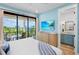 Comfortable bedroom with balcony access, offering beautiful views and a serene, bright atmosphere at 135 Avenida Veneccia, Sarasota, FL 34242
