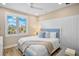Comfortable bedroom with bright, natural light, calming blue accents, and coastal charm at 135 Avenida Veneccia, Sarasota, FL 34242