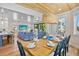Dining area flows into the living space, with a statement light fixture, great for entertaining at 135 Avenida Veneccia, Sarasota, FL 34242