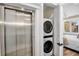 Convenient elevator and stacked washer/dryer in-unit, offering accessibility and ease at 135 Avenida Veneccia, Sarasota, FL 34242