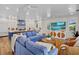Bright, open living space with a comfortable blue couch and kitchen view, ideal for entertaining at 135 Avenida Veneccia, Sarasota, FL 34242