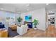 Bright living space with coastal decor, a flat-screen TV, and access to a laundry room at 135 Avenida Veneccia, Sarasota, FL 34242