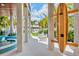Unique outdoor shower in surfboard shape with private outdoor setting near pool at 135 Avenida Veneccia, Sarasota, FL 34242