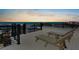 Relax on this rooftop deck with ocean views and comfortable lounge chairs at 135 Avenida Veneccia, Sarasota, FL 34242
