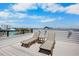 Enjoy city and ocean views from this spacious rooftop deck with lounge seating at 135 Avenida Veneccia, Sarasota, FL 34242