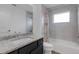 Bathroom featuring a granite vanity top, a toilet, and a bathtub with a shower at 1370 Mccrory St, North Port, FL 34286