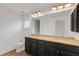 Bathroom featuring double granite vanity top sinks, a toilet, and a shower at 1370 Mccrory St, North Port, FL 34286