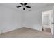 Clean and bright bedroom with neutral carpet, ceiling fan, and lots of natural light at 1370 Mccrory St, North Port, FL 34286