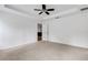 Spacious carpeted bedroom with a ceiling fan and an adjacent closet at 1370 Mccrory St, North Port, FL 34286