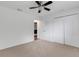 Nicely carpeted bedroom with ceiling fan and an adjacent closet at 1370 Mccrory St, North Port, FL 34286