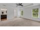 Bright main bedroom with a tray ceiling, a ceiling fan, and ensuite bathroom at 1370 Mccrory St, North Port, FL 34286