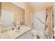 Bathroom with a single sink, large mirror, and accessible tub-shower with safety bar at 1516 Red Oak Ln, Port Charlotte, FL 33948