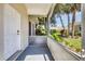 Front porch with a painted floor overlooking the front yard at 1516 Red Oak Ln, Port Charlotte, FL 33948