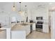 Bright kitchen with stainless steel appliances, modern countertops, and stylish pendant lighting at 1516 Red Oak Ln, Port Charlotte, FL 33948