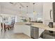 Bright eat-in kitchen features recessed lights, an efficient layout, and breakfast nook with bay window at 1516 Red Oak Ln, Port Charlotte, FL 33948