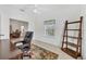Well-lit office space offers a calm work environment with natural light and practical furnishings at 1516 Red Oak Ln, Port Charlotte, FL 33948