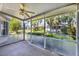 Relaxing screened-in patio offers peaceful views of the lush landscaping and neighborhood at 1516 Red Oak Ln, Port Charlotte, FL 33948