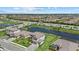 Aerial view of homes with lake views and beautifully landscaped yards in a planned community at 15315 Golden Beam Pl, Bradenton, FL 34211