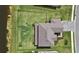 Aerial image showcases home with adjacent pond and community with well-manicured yards at 15315 Golden Beam Pl, Bradenton, FL 34211