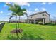 The exterior shows a spacious backyard, screened in porch and privacy fence at 15315 Golden Beam Pl, Bradenton, FL 34211