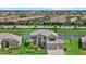 Stunning waterfront home with lush landscaping and tile roof in a desirable neighborhood at 15315 Golden Beam Pl, Bradenton, FL 34211