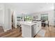 Stylish kitchen with a center island, stainless steel appliances, modern finishes, and seamless flow to the adjacent living spaces at 15315 Golden Beam Pl, Bradenton, FL 34211