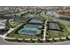 Aerial view of community with tennis and basketball courts and lush green spaces by a serene lake at 15607 White Linen Dr, Bradenton, FL 34211
