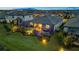 Aerial view of the pool and lanai showing landscape lighting and proximity to other homes at 15607 White Linen Dr, Bradenton, FL 34211