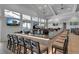 A well stocked bar with TVs and modern seating provides entertainment and relaxation at 15607 White Linen Dr, Bradenton, FL 34211