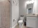 This bathroom features a shower, toilet, sink, and granite countertops at 15607 White Linen Dr, Bradenton, FL 34211