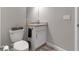 This bathroom has a toilet, sink, granite countertops and vanity at 15607 White Linen Dr, Bradenton, FL 34211
