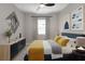 This staged bedroom features a dark dresser, a queen bed and gray walls at 15607 White Linen Dr, Bradenton, FL 34211