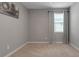 Neutral bedroom offers a cozy window and carpet flooring at 15607 White Linen Dr, Bradenton, FL 34211