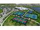 Aerial view of community amenities including clubhouse, pools, tennis, pickleball and basketball courts at 15607 White Linen Dr, Bradenton, FL 34211