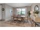 Inviting dining room featuring a wooden table with seating for six, and contemporary decor at 15607 White Linen Dr, Bradenton, FL 34211
