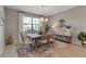 Bright dining room featuring modern furnishings and a large window at 15607 White Linen Dr, Bradenton, FL 34211