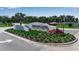 Community entrance sign for Lorraine Lakes at Lakewood Ranch surrounded by colorful plants at 15607 White Linen Dr, Bradenton, FL 34211