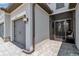 Charming home exterior featuring a stone accent, gray door and matching garage doors, with manicured landscaping at 15607 White Linen Dr, Bradenton, FL 34211