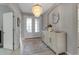 Bright foyer featuring tile floors, a modern chandelier, and an open view into the living spaces at 15607 White Linen Dr, Bradenton, FL 34211