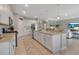 This kitchen flows into a living room and features a large island with barstool seating at 15607 White Linen Dr, Bradenton, FL 34211