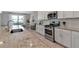 Granite countertops accent white cabinets and stainless steel appliances in this modern kitchen at 15607 White Linen Dr, Bradenton, FL 34211