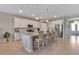 Bright kitchen with stainless steel appliances, granite countertops, and an island with barstool seating at 15607 White Linen Dr, Bradenton, FL 34211