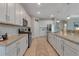 This kitchen boasts white cabinets, granite countertops and stainless steel appliances at 15607 White Linen Dr, Bradenton, FL 34211