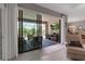 Open concept living area flows to screened lanai with seating and TV at 15607 White Linen Dr, Bradenton, FL 34211