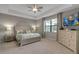 Tranquil main bedroom with tray ceiling, neutral color scheme, and large window for ample natural light at 15607 White Linen Dr, Bradenton, FL 34211
