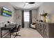 Comfortable office space with a dark desk, neutral walls, and modern furnishings at 15607 White Linen Dr, Bradenton, FL 34211