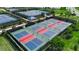 Aerial view of new pickleball courts with green and red surfaces at 15607 White Linen Dr, Bradenton, FL 34211