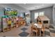 Charming playroom with colorful shelves, toys, a table and chairs, and playhouse at 15607 White Linen Dr, Bradenton, FL 34211