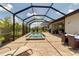 This home features a screened pool and spa, complemented by an outdoor entertainment area for year-round enjoyment at 15607 White Linen Dr, Bradenton, FL 34211