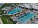 Resort-style pool area featuring a lap pool, recreational pool, and kiddie pool with lounge chairs at 15607 White Linen Dr, Bradenton, FL 34211
